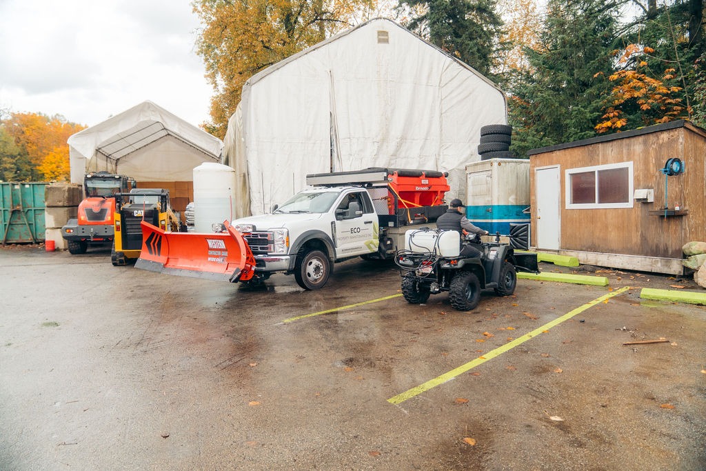 Maintenance yard with snowplow truck and ATV