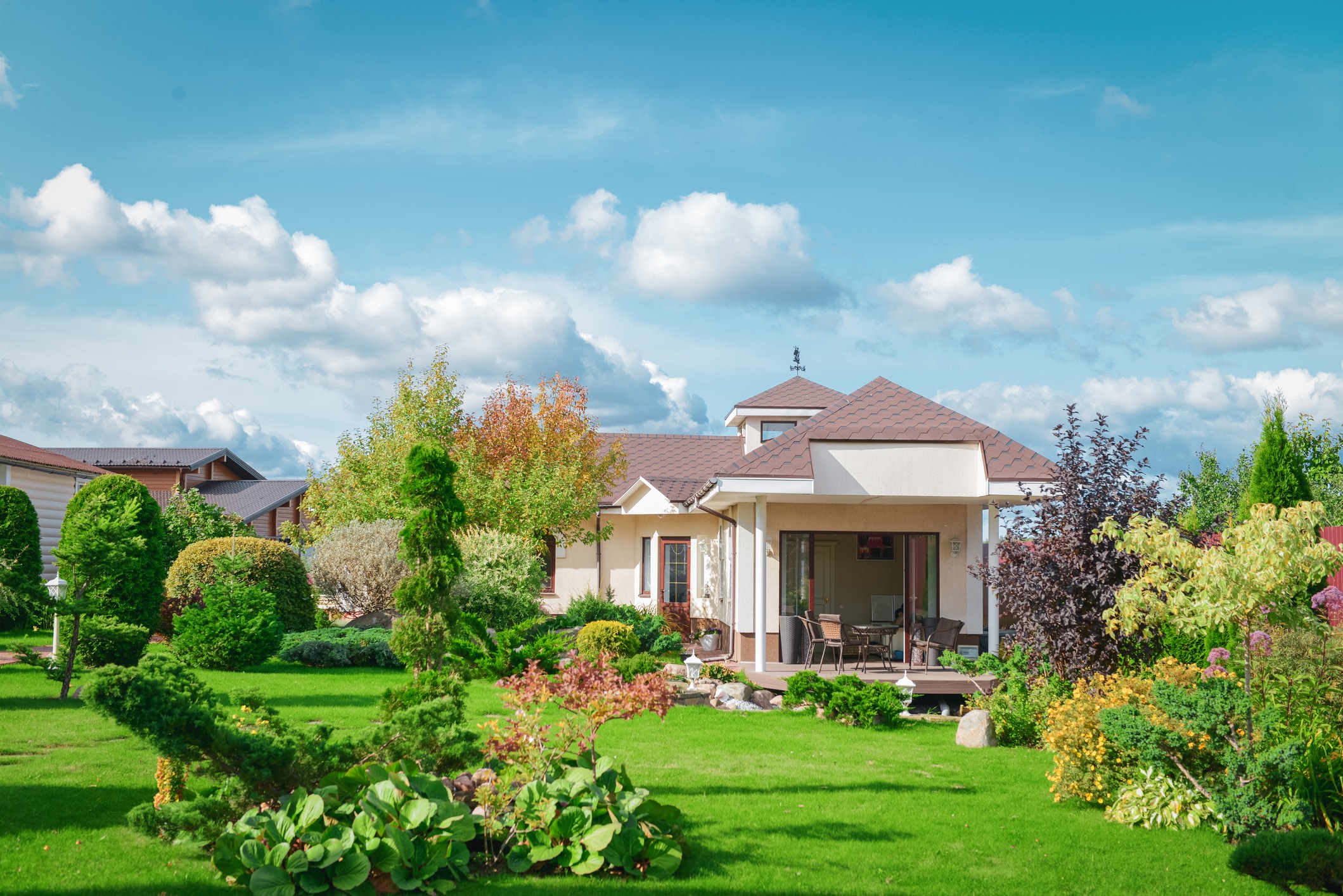 Modern house with landscaped garden and green lawn